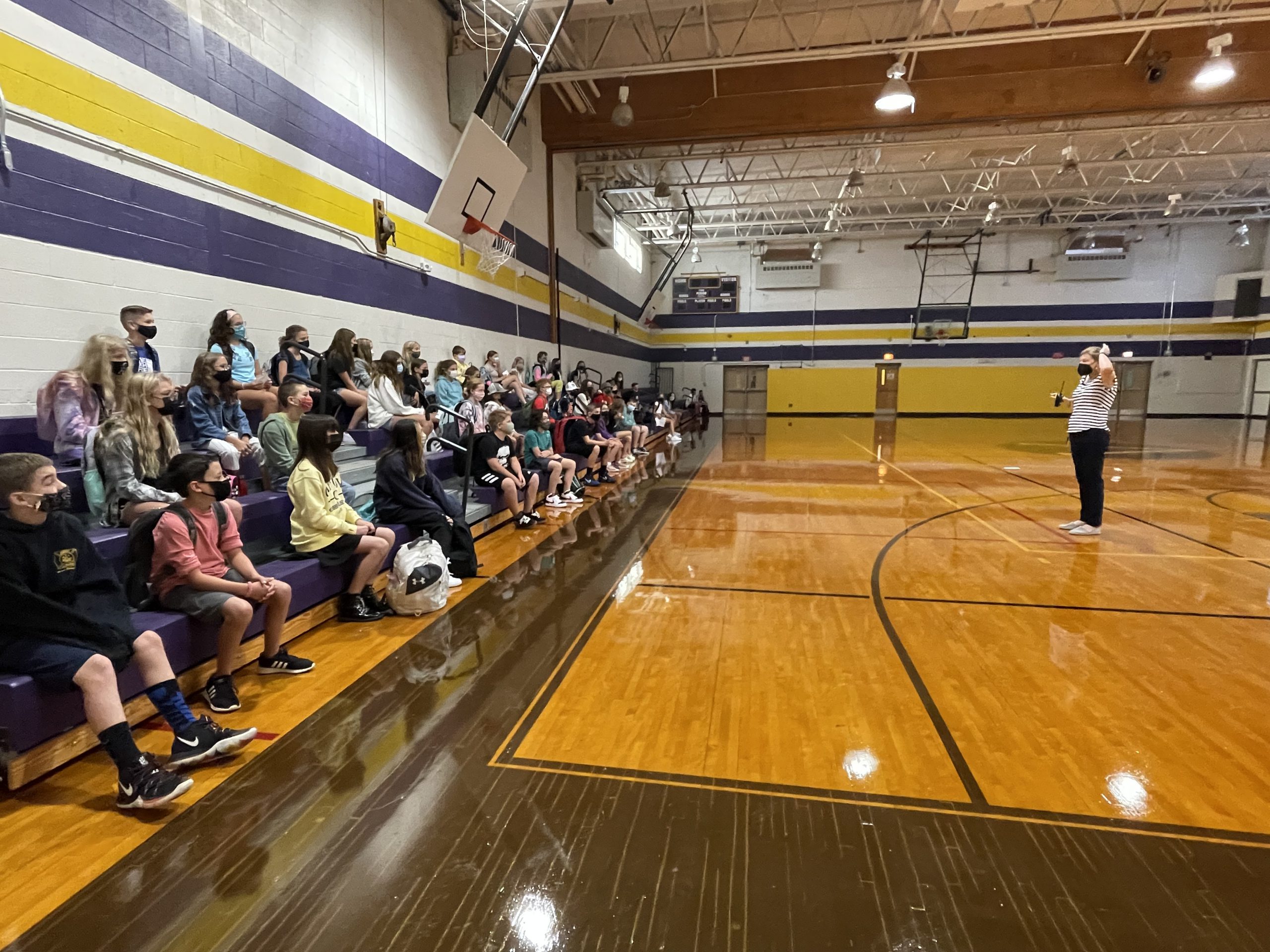 students sitting on bleachers