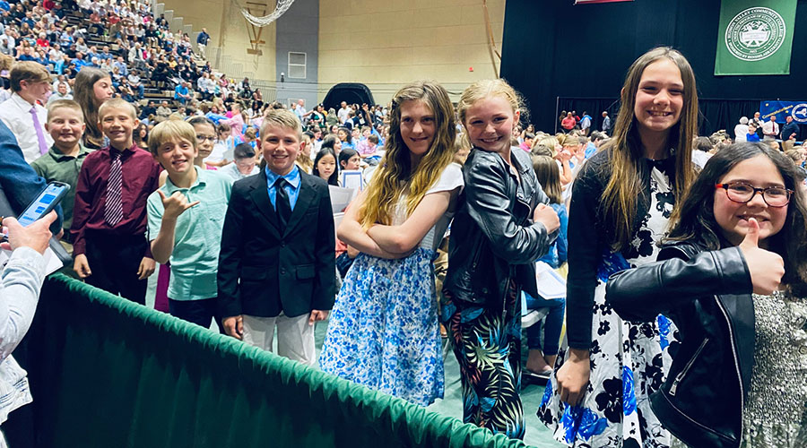 Sandra G. Morley Physical Education Award honorees stand in a group. The grade 5 students are wearing formal clothes.