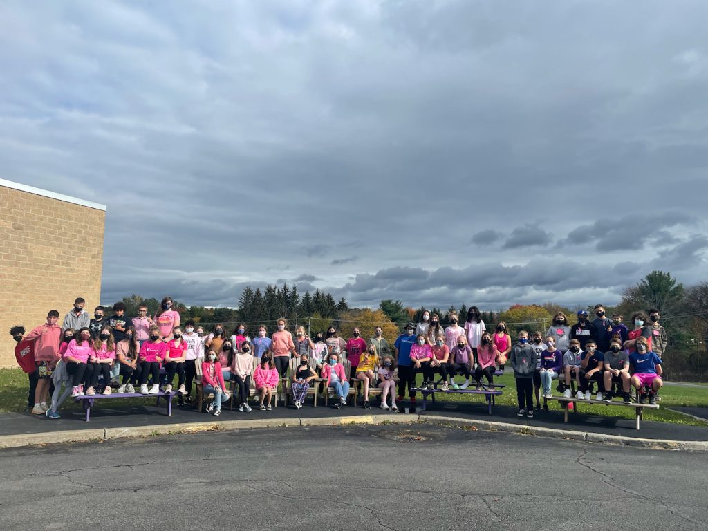 MS students wearing PINK pose outside MS wing in support of Breast Cancer Awareness.