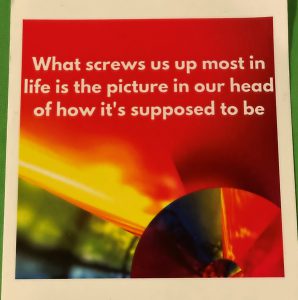card that's mostly red, but also orange, tellow, green and blue with the words - what screws us up most in life is the picture in our head of how it's supposed to be