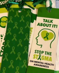 bookmarks that are green and yellow that have talk about it, stop the stigma written on it