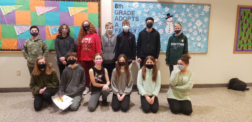 seven students stand posed for the camera and six are kneeling