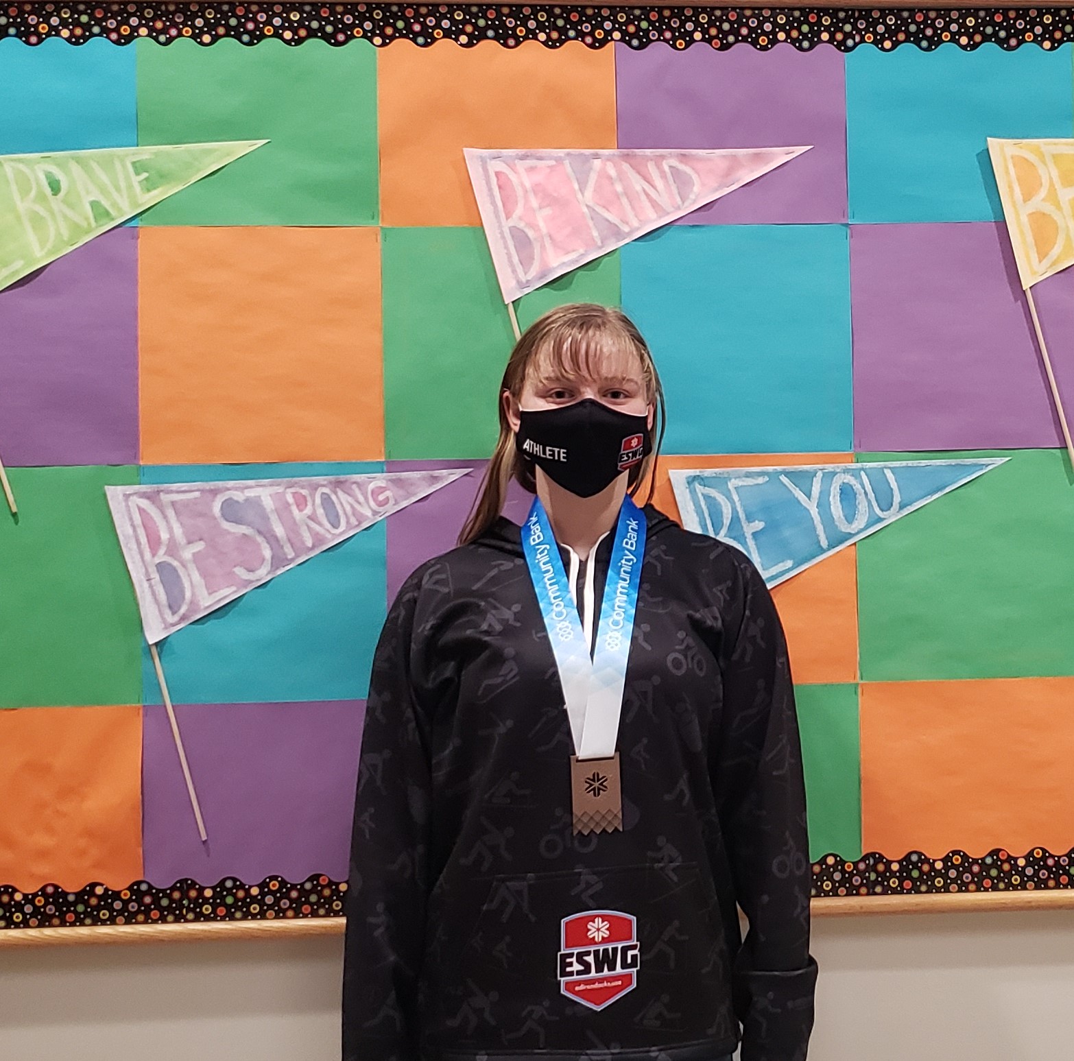 student wearing a bronze medal from a figure skating competition at The Empire State Winter Games