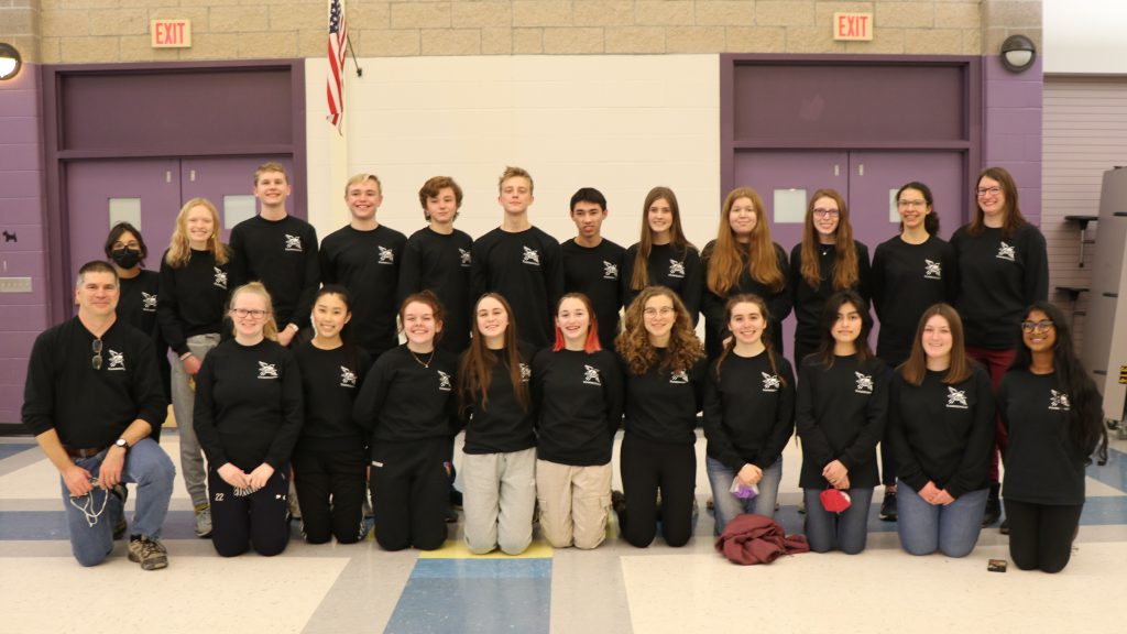 group photo everyone wearing black sweatshirts