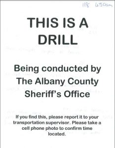 Note reads "This is a drill being conducted by the Albany County Sheriff's Office"