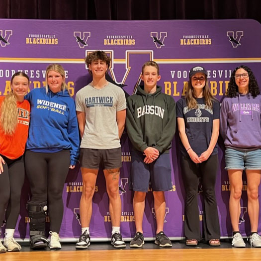 Voorheesville Signing Day six students stand together