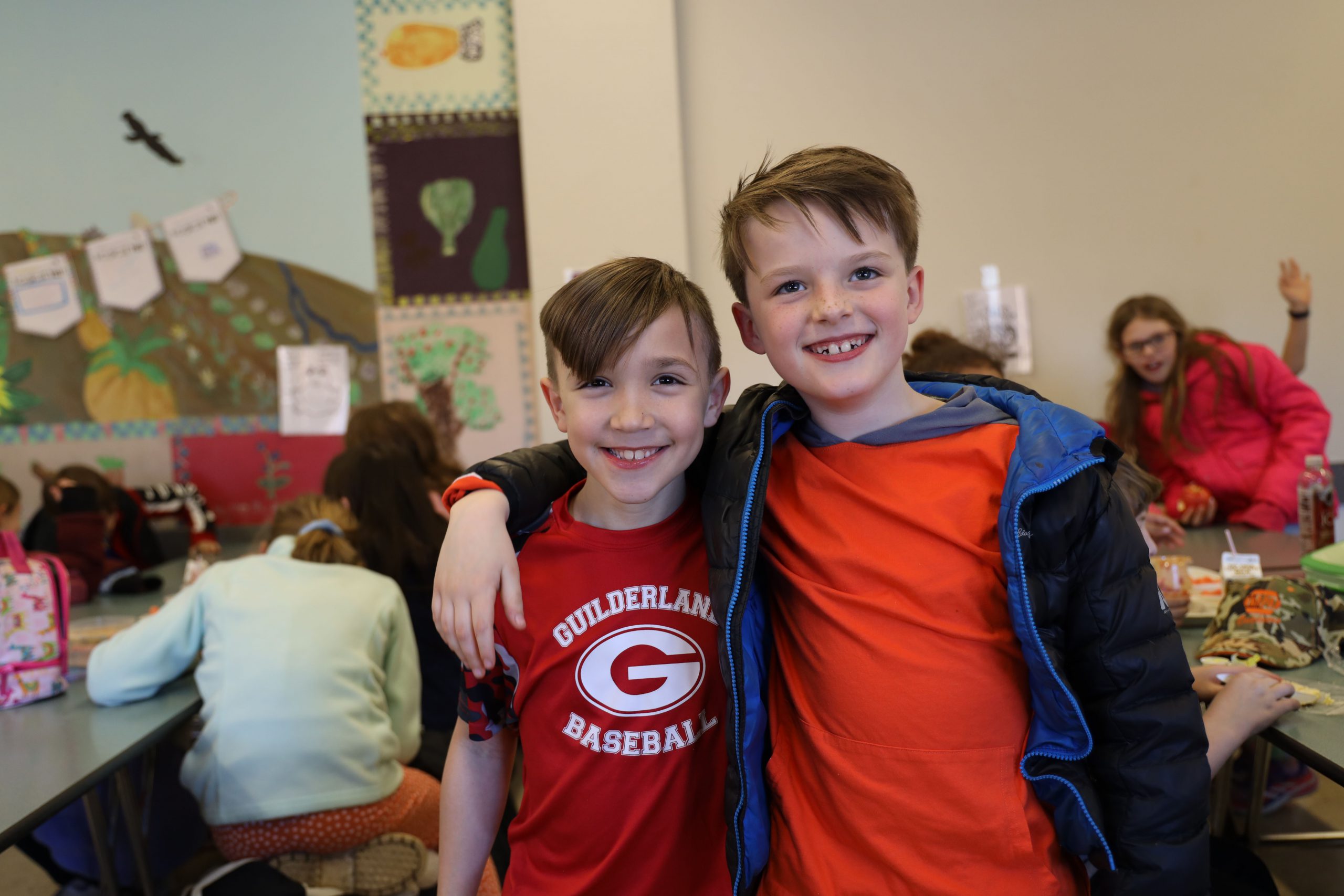 Voorheesville boys in cafeteria arm around