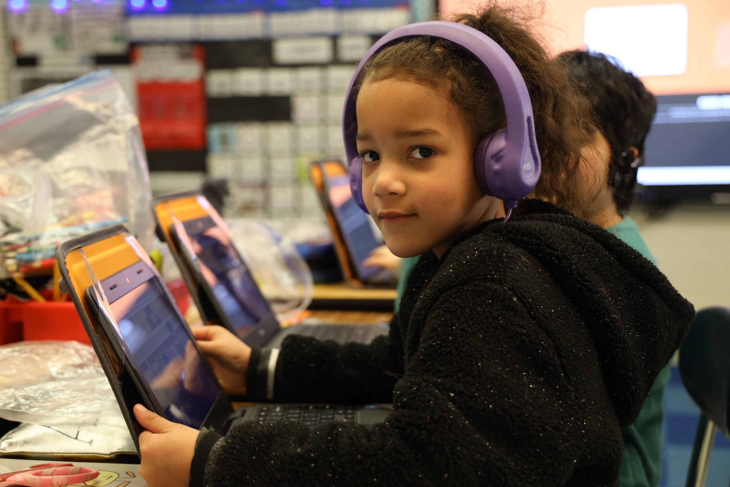 voorheesville elementary girl with computer and headphones 
