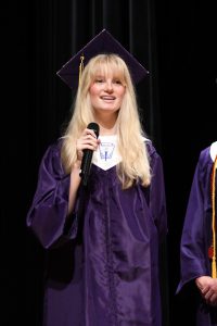 Student on graduation stage.