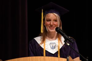 Student on graduation stage.