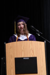 Student on graduation stage.