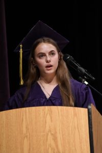 Student on graduation stage.