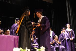 Student receiving diploma