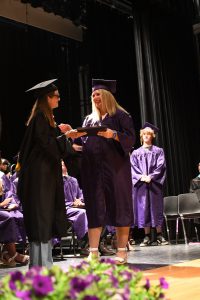 Student receiving diploma