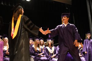 Student receiving diploma