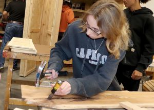 Michaud works on a table top in the Capital Region BOCES Building Trades program.