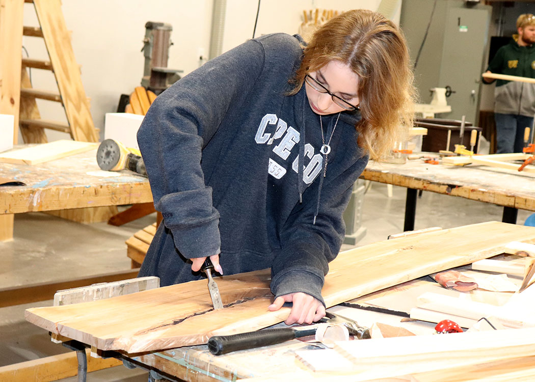 Michaud works on a table top in the Capital Region BOCES Building Trades program.