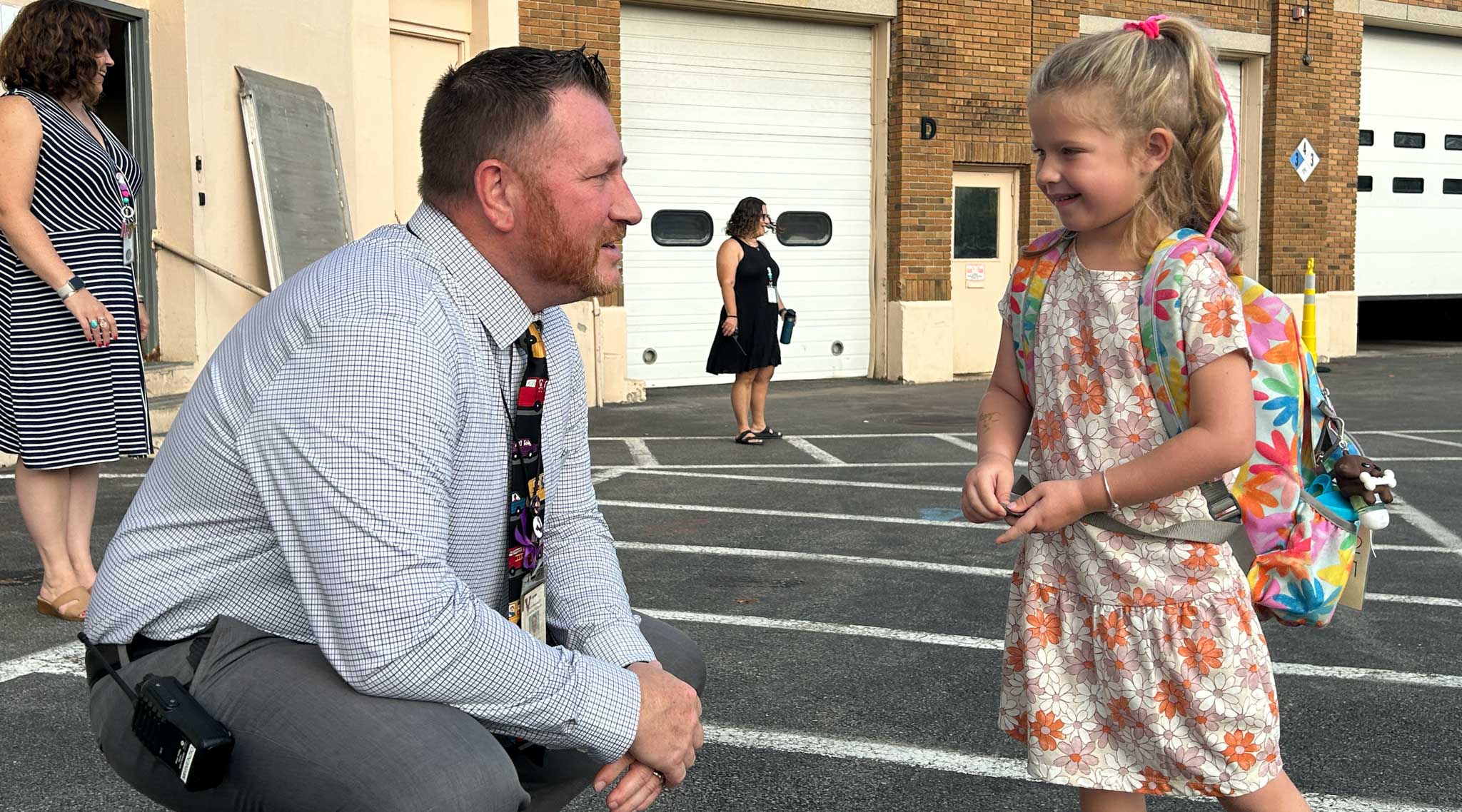 VCSD Principal Jeff Vivenzio at eye level with student.