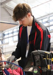 Cody Hosgood works on HVAC system