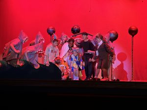 Students dressed in costumes, on stage for Finding Nemo.