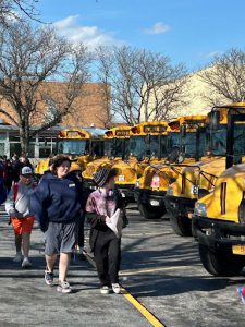 VCSD buses in a line with students.