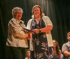 Betty Filkins accepts diploma from Principal Cardillo.