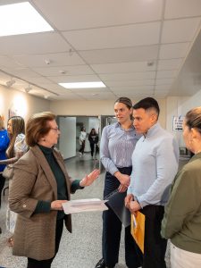 League of Women Voters volunteer provides new citizens with voting information.