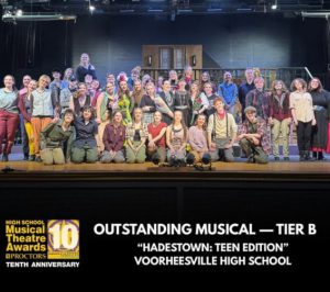 Cast and Crew of Hadestown stand on stage at Proctors.